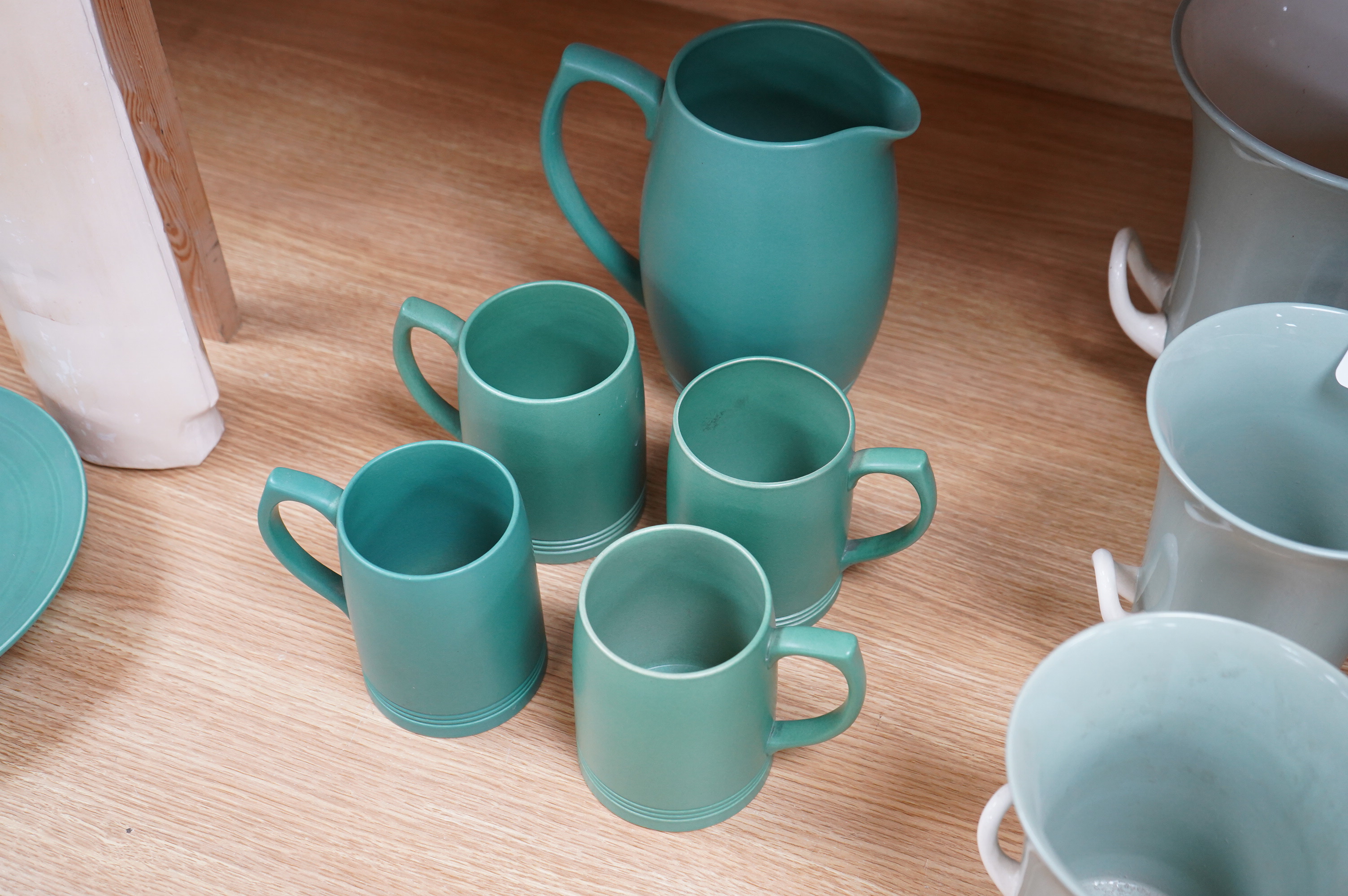 Keith Murray for Wedgwood green glazed lemonade jug and four green mugs, largest 21cm high